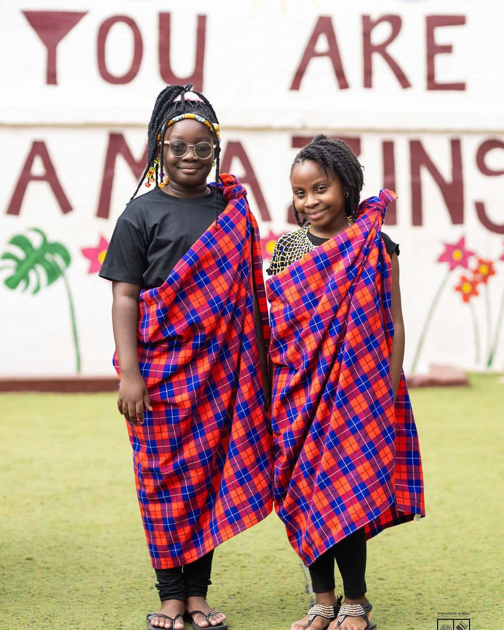 Two pupils in Maasai shuka