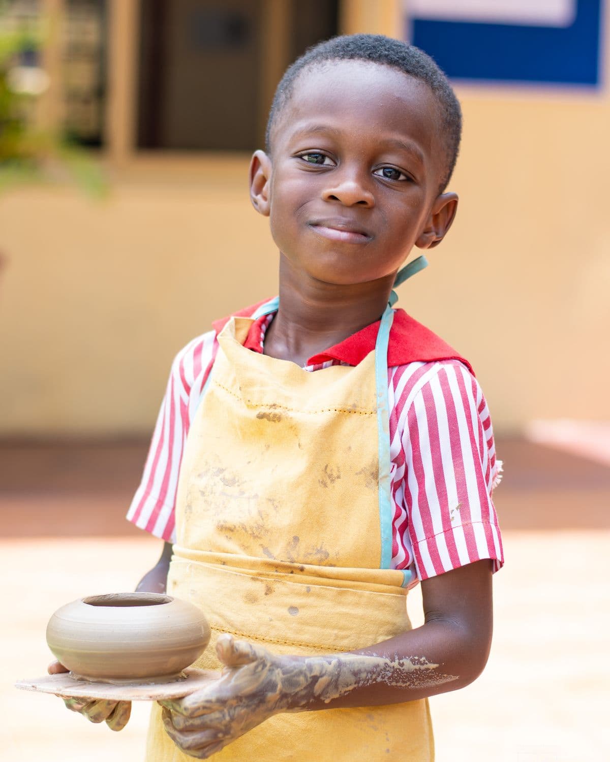 A pot carried carefully to the drying tray