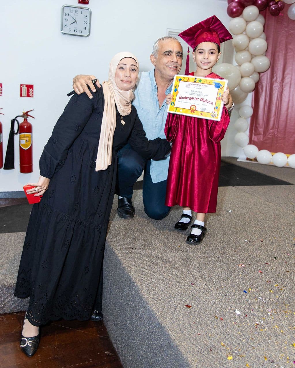 A graduate with her family after the ceremony