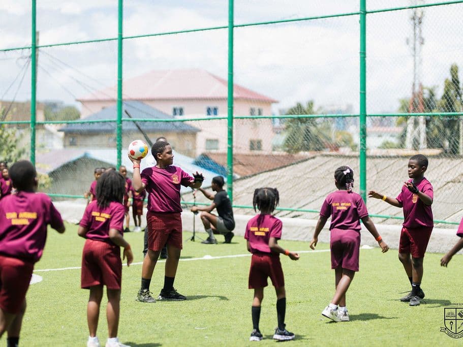 Pupils playing on the astroturf pitch the school uses for sport