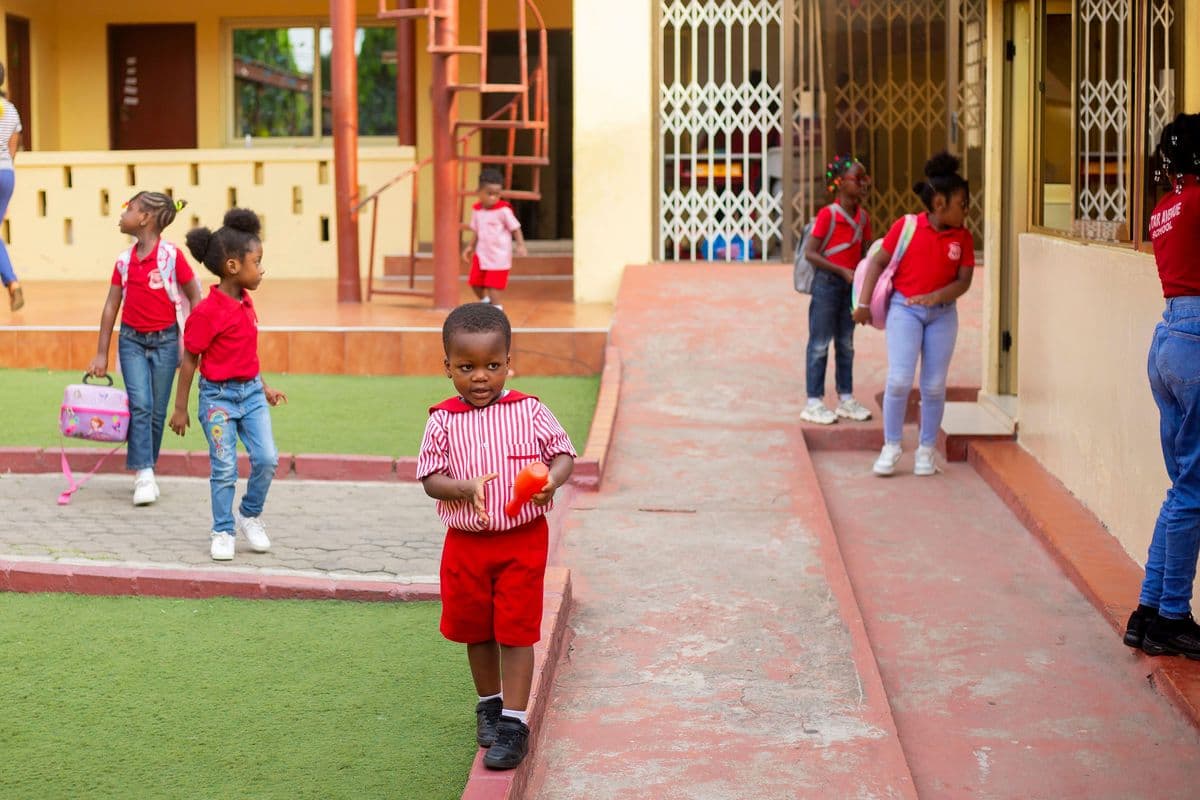 Pupils walking along the school veranda on the first morning of term